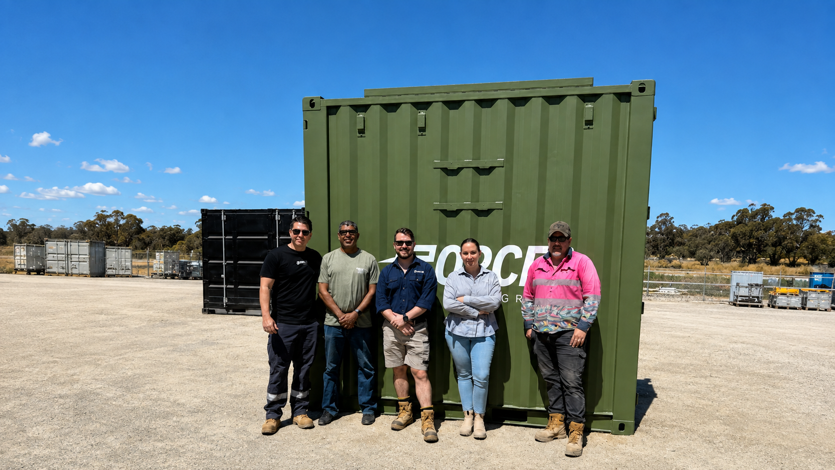 Delivery team beside the containerised system for the ADF/PNG project