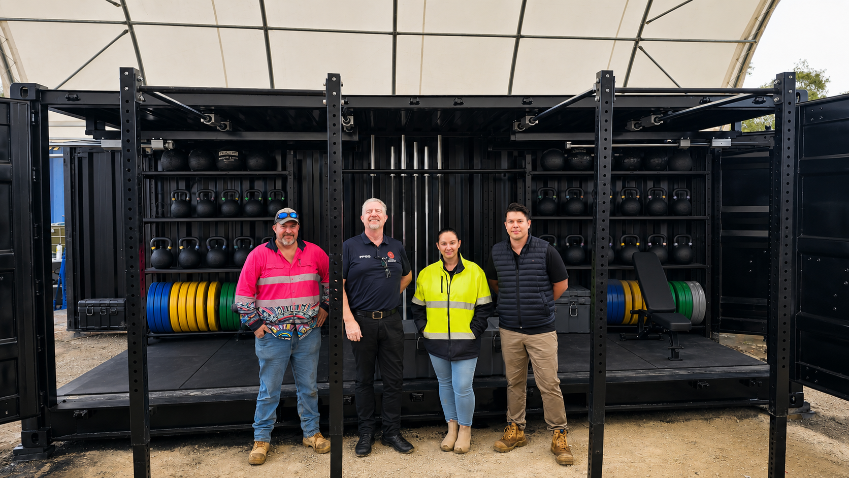 Project team in front of the delivered Rapid-20 training system for AFP/PNG